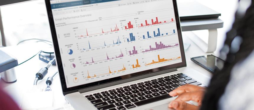 A person reviews a Tableau dashboard in a stock image photo. 
