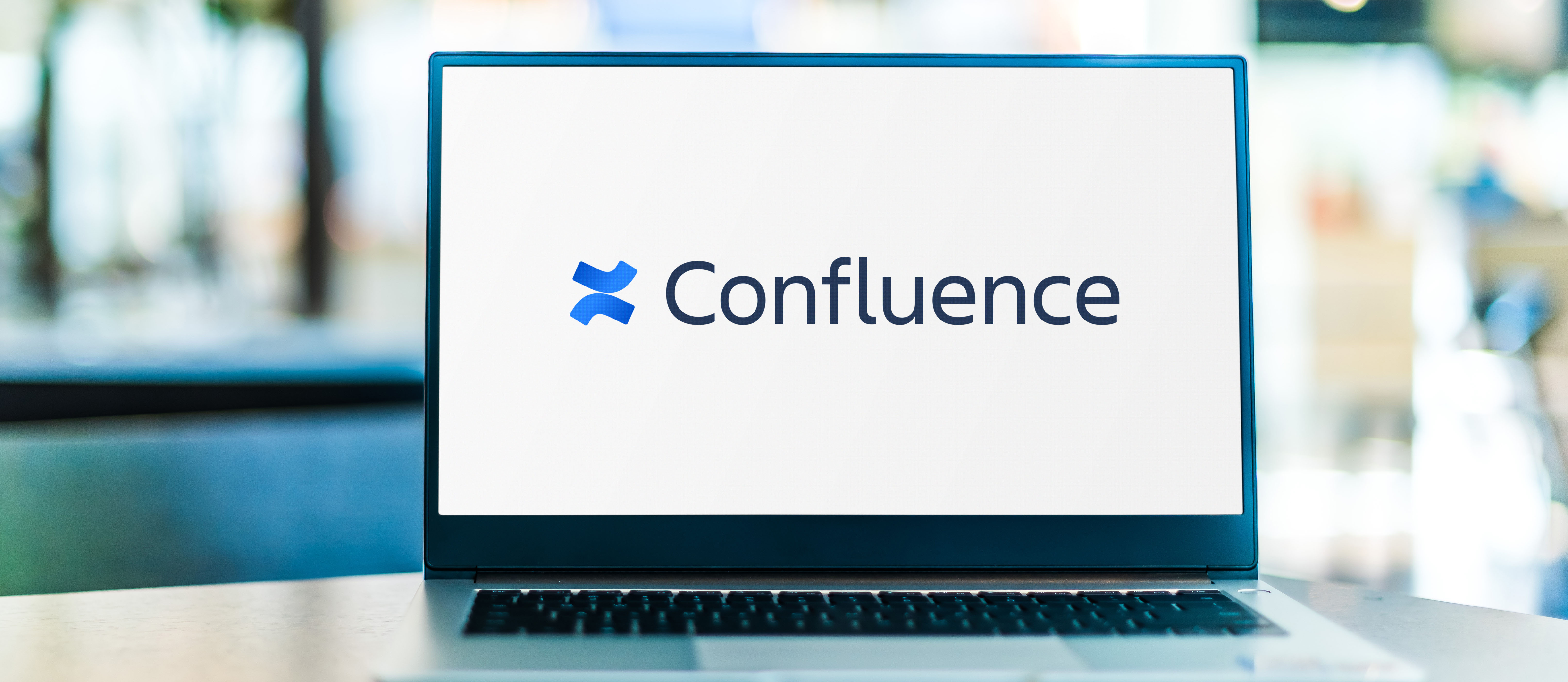 image of a computer with the Confluence logo on the screen