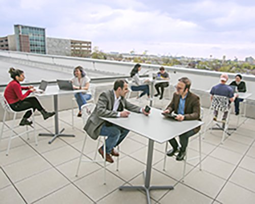 people on rooftop with devices